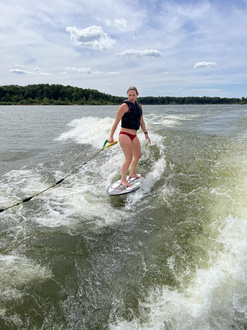 Woman Surfing on wakeboarder