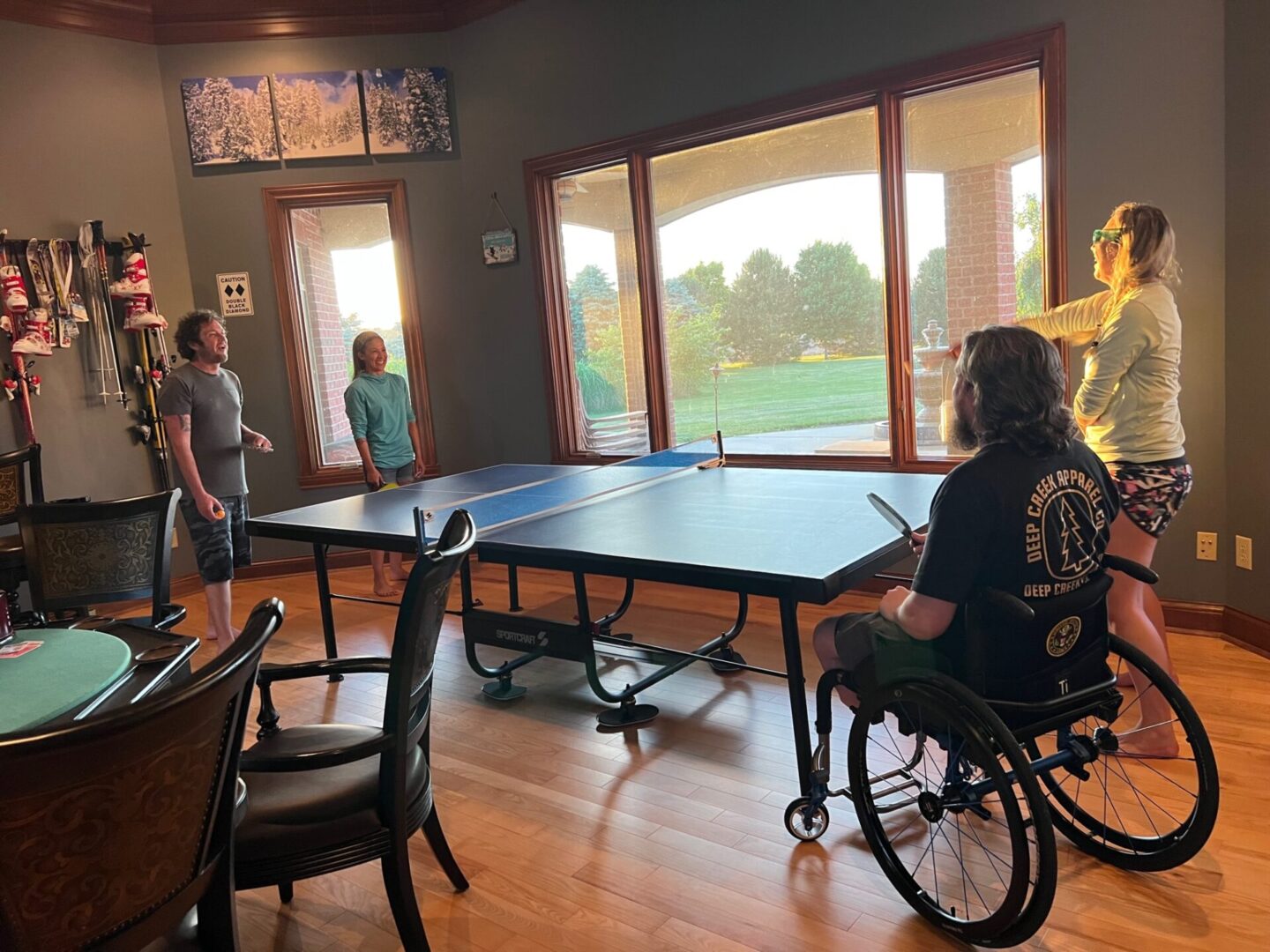 A disabled man in a wheelchair playing table tennis