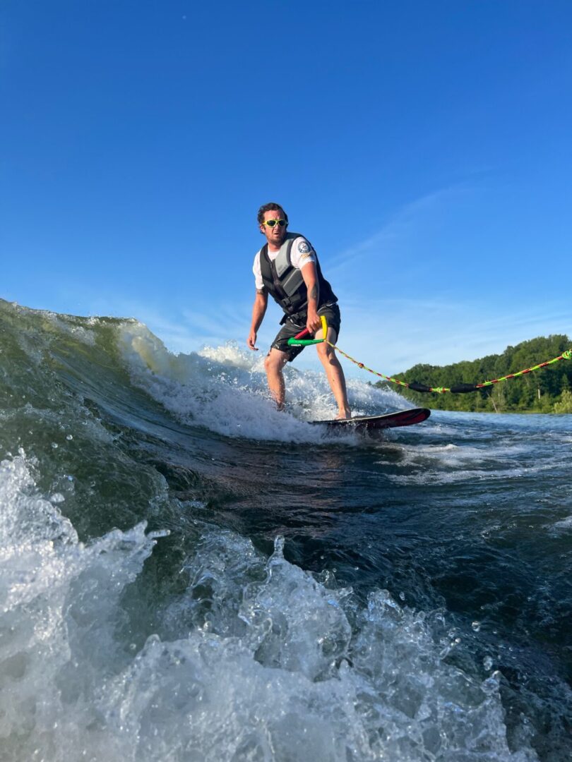 Surfing on a Surfboard Drawn by a Motor Boat