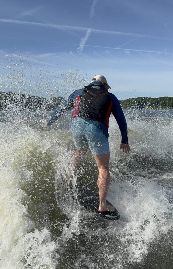Person wakesurfing on a sunny day.