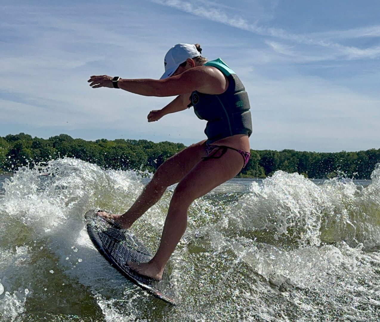 Person wakesurfing on a sunny day.
