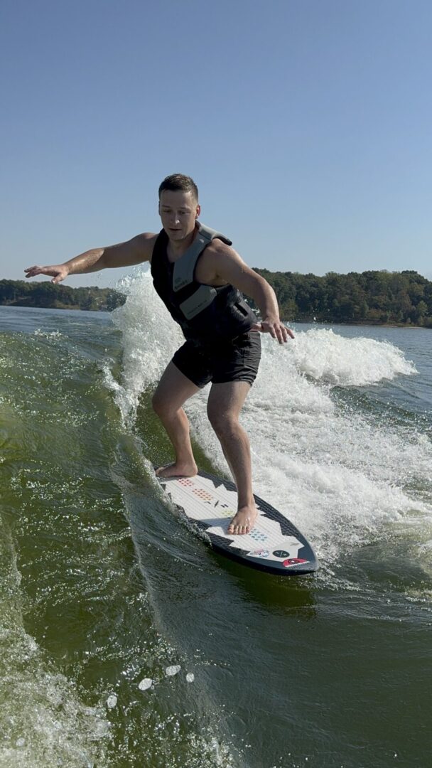 Person wakeboarding on a sunny day.