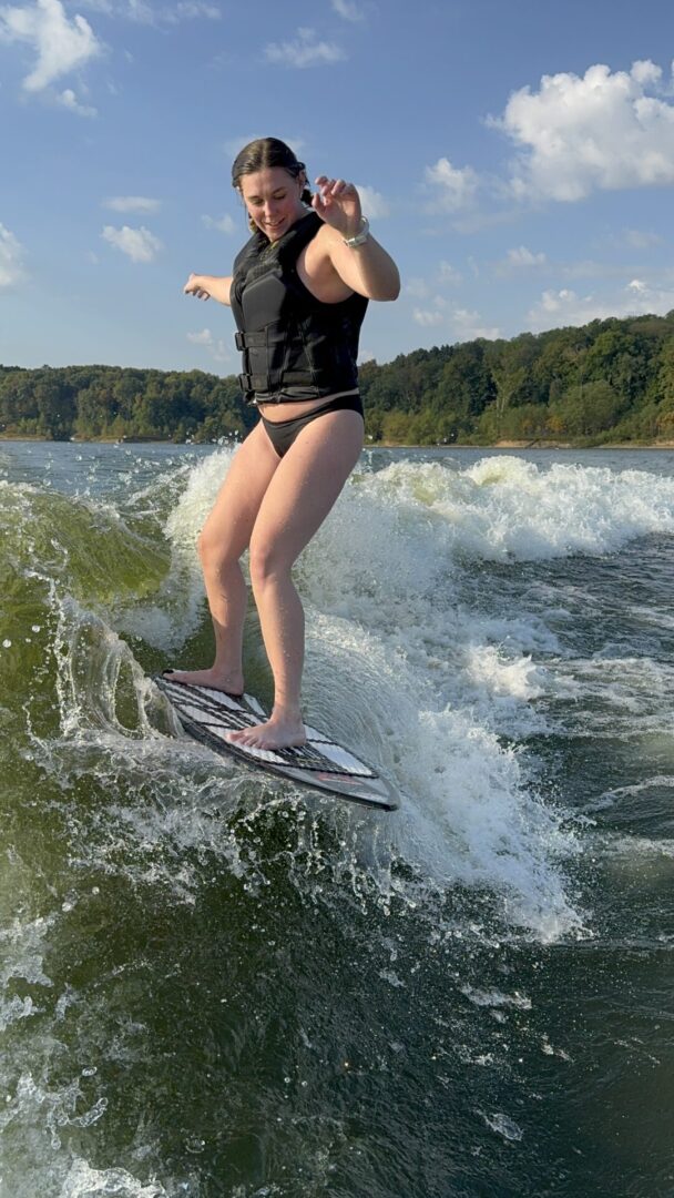 Person wakesurfing on a sunny day.