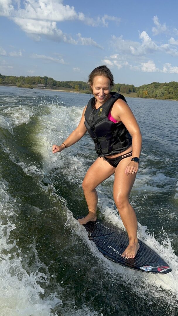 Person wakesurfing on a sunny day.